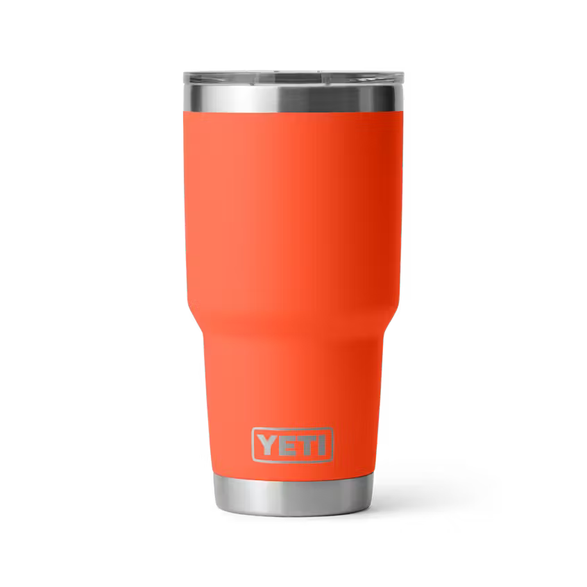 Orange YETI tumbler with a silver lid on a white background