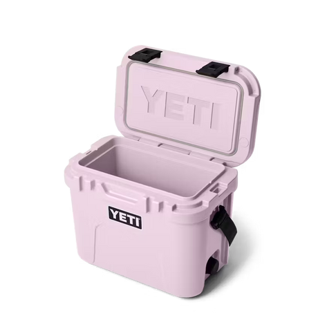 Pink YETI cooler with open lid on a white background