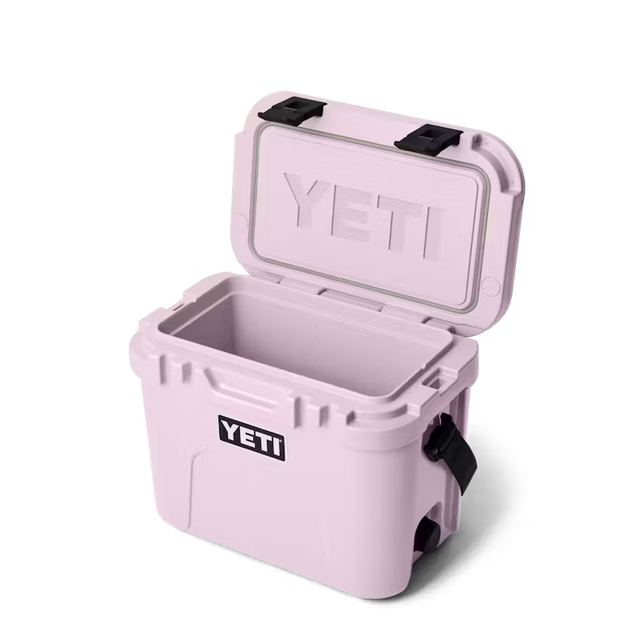 Pink YETI cooler with open lid on a white background