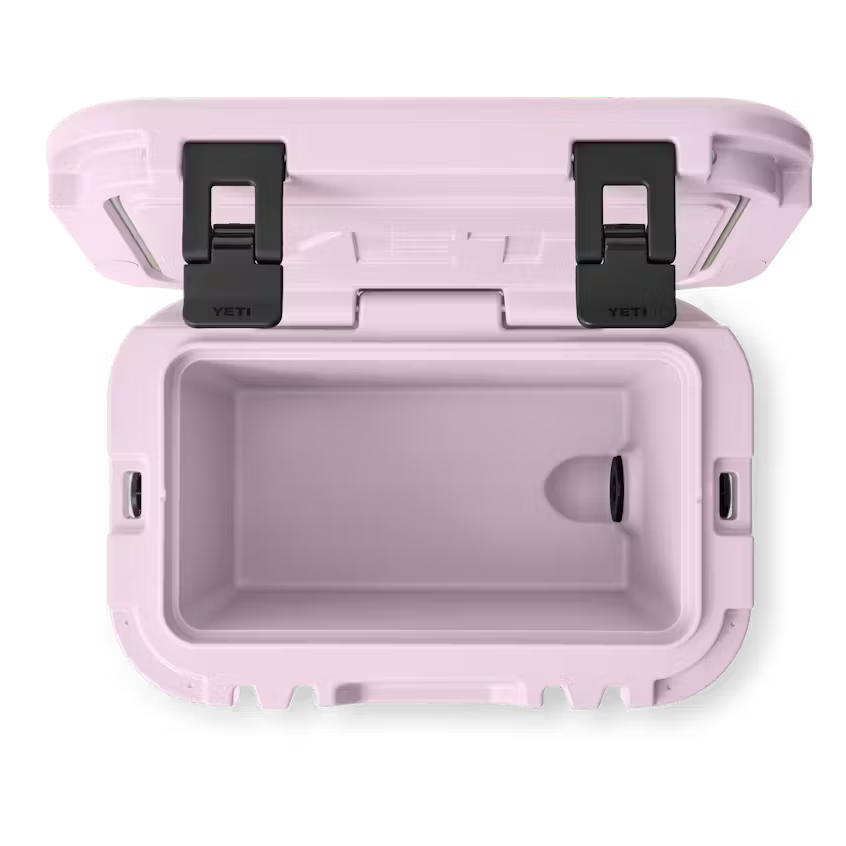 Pink cooler with open lid on a white background