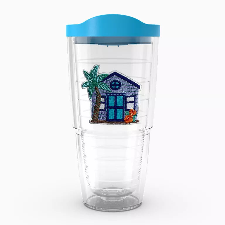Clear tumbler with a blue lid featuring a beach house design on a white background