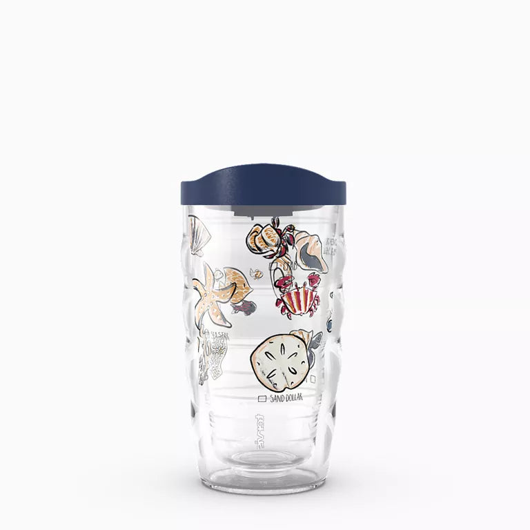 Clear tumbler with sea-themed designs and a navy lid on a white background