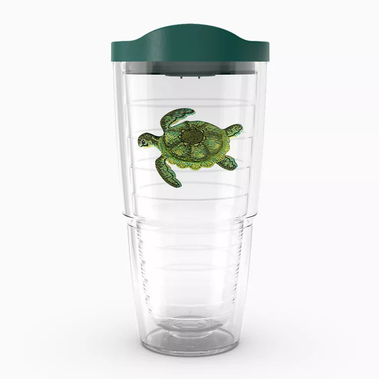 Clear tumbler with a green turtle design and green lid on a white background