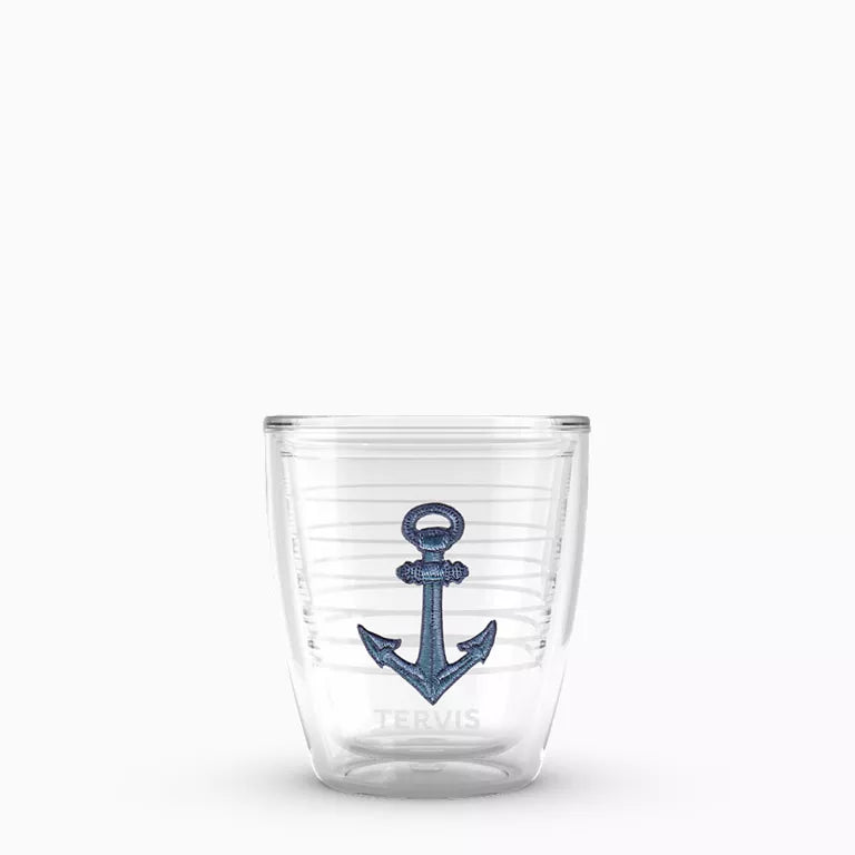 Clear glass tumbler with a blue anchor design on a white background