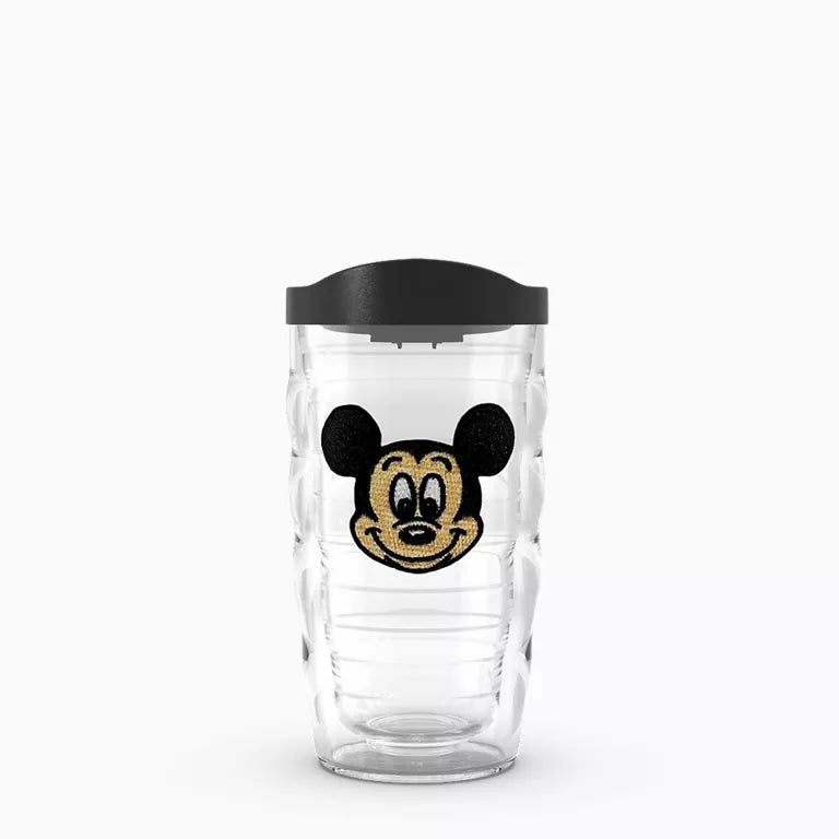 Clear tumbler with black lid featuring a cartoon character on a white background