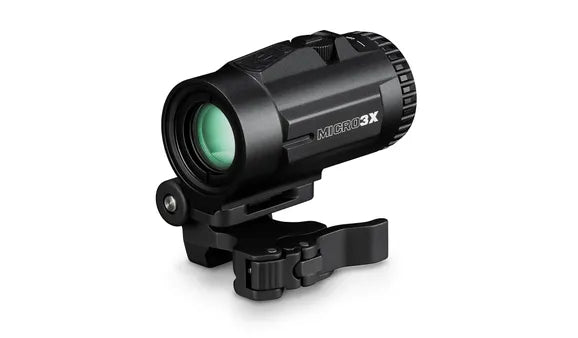 Black monocular with green lens on a white background