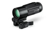 Black monocular with green lens on a white background
