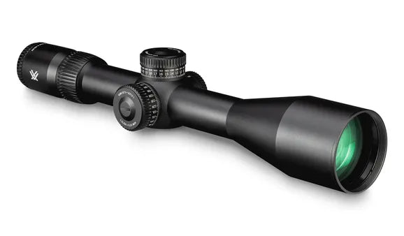 Riflescope with green lens on a white background