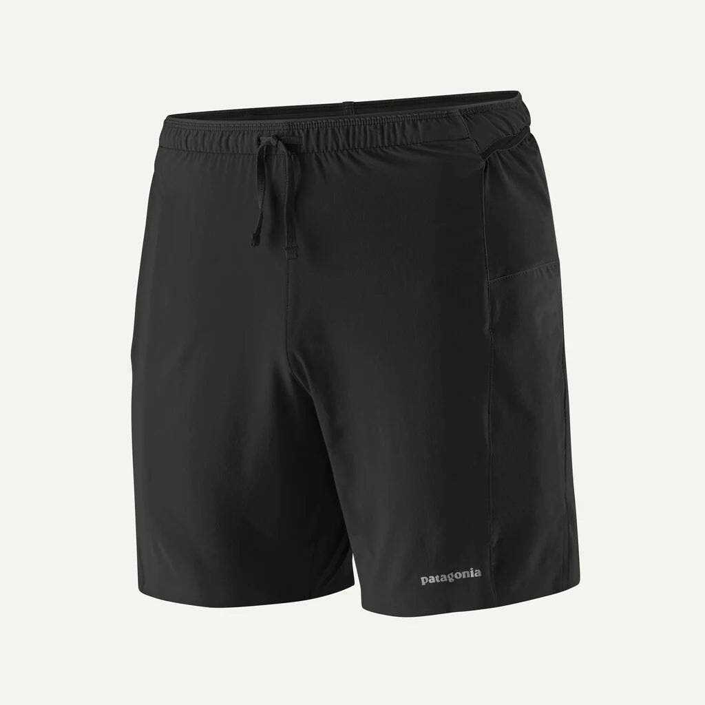 Black shorts with a drawstring on a light gray background