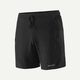 Black shorts with a drawstring on a light gray background