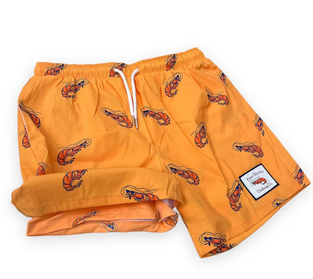 Yellow shorts with a pattern on a white background