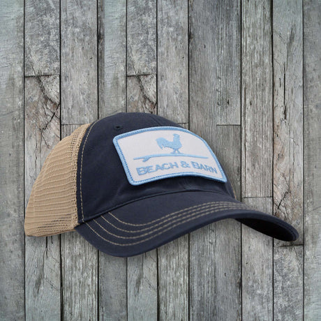 Navy blue and beige cap with a patch on a wooden background