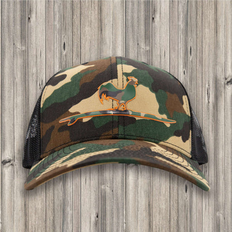 Camouflage baseball cap with a graphic design on a wooden background