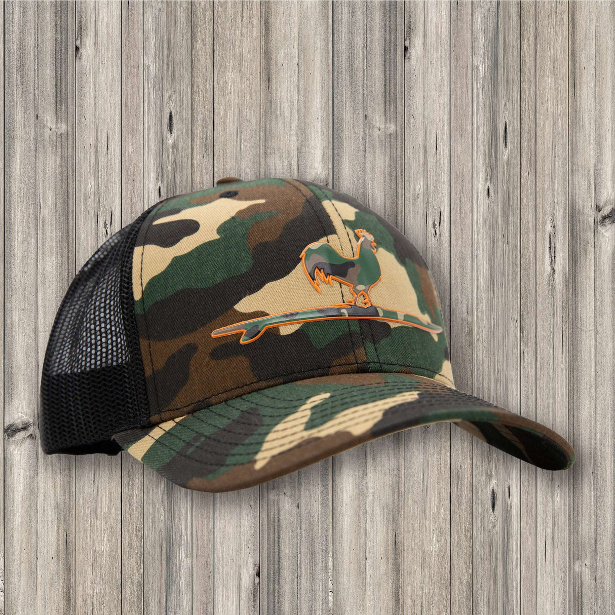 Camouflage baseball cap with mesh back on a wooden background