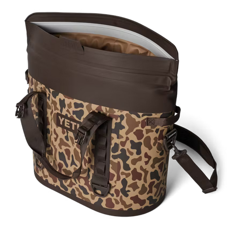 Camouflage-patterned cooler bag with YETI logo on a white background