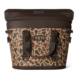 Camouflage-patterned cooler bag with YETI logo on a white background