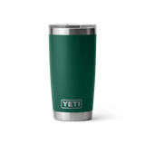 Green YETI tumbler with silver lid on a white background