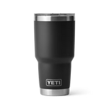 Black YETI tumbler with silver lid on a white background