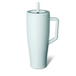 White mug with handle and straw on a white background