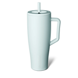 White mug with handle and straw on a white background