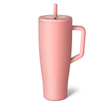 Pink insulated mug with a straw on a white background
