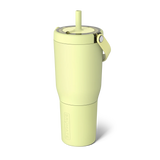 Light green tumbler with a straw on a white background