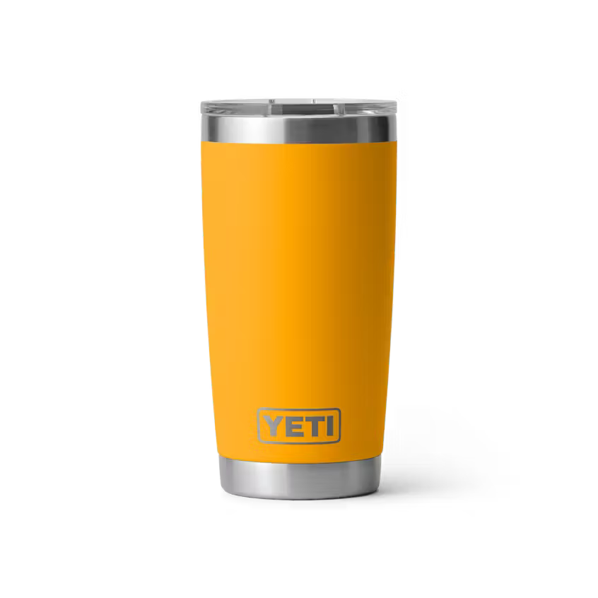 Yellow YETI tumbler with a silver lid on a white background