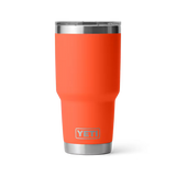 Orange YETI tumbler with a silver lid on a white background